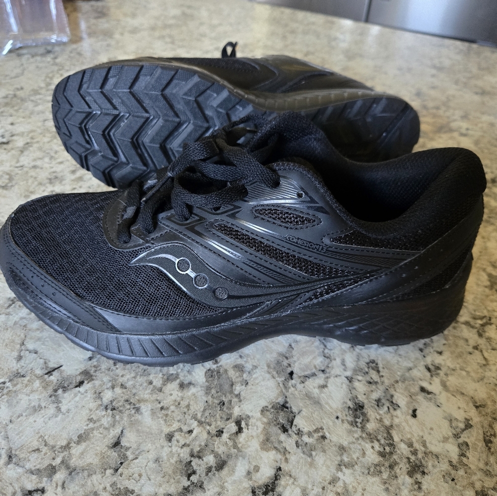 Like new saucony black running shoes size 9 W womans